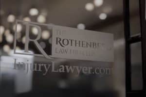 The Rothenberg Law Firm logo on glass