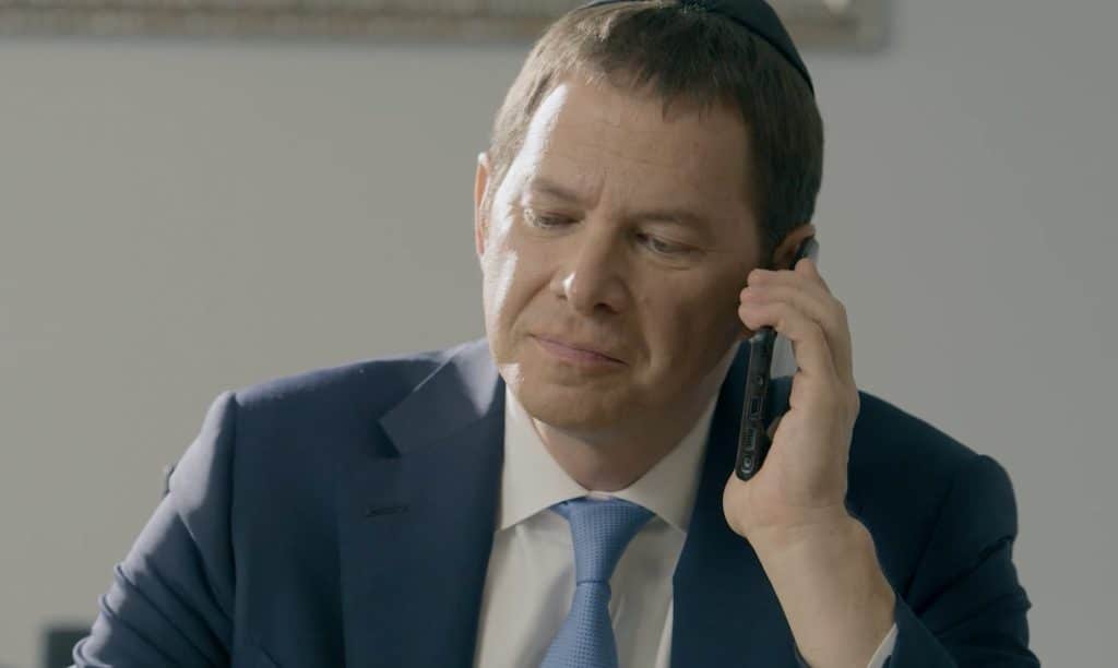 Marc J. Rothenberg speaking on a cell phone